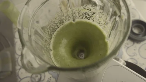 Preparing green juice Stock Footage 86153586