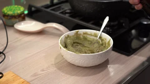 Preparing a Green Sauce: A Step-by-Step Guide to Making a Delicious and Stock Footage 321051152