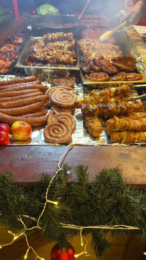 Preparing grilled pork meat sausages.Traditional Christmas street food Stock Footage 293639769