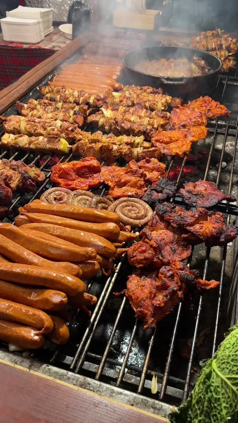 Preparing grilled pork meat sausages.Traditional Christmas street food Stock Footage 293639771