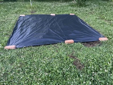 Preparing ground base for inflatable pool Stock Photos