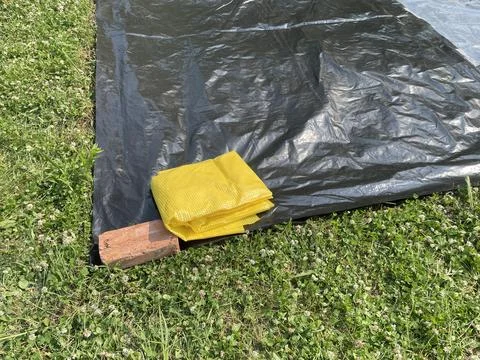 Preparing ground base for inflatable pool Stock Photos