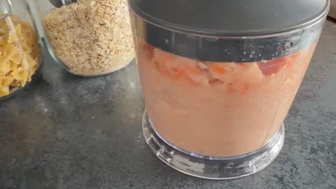 Preparing ground chicken using a blender. Stock Footage 345494922