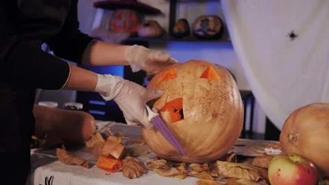 Preparing for Halloween. Carving a pumpkin. Stock Footage 320788126