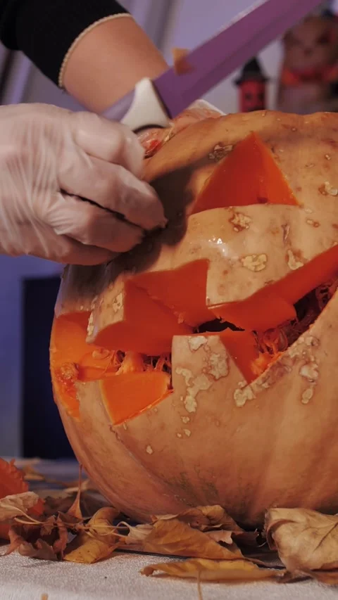 Preparing for Halloween. Pumpkin Carving Close-Up, Vertical Video. Video stock 320894770