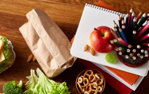 Preparing ham sandwiches for scool lunchbox on wooden background, close up. Stock Photos