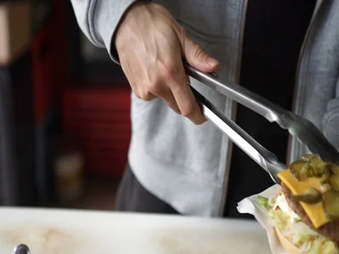 Preparing a hamburger Stock Footage 79075345