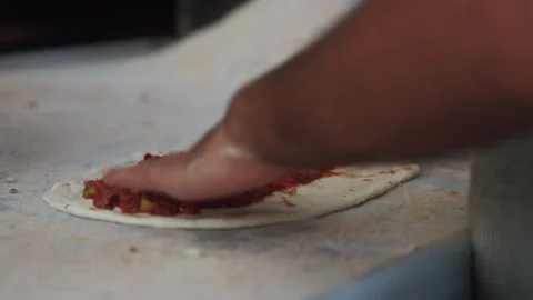 Preparing hand made Pastry and putting peppers inside Stock Footage 270211301