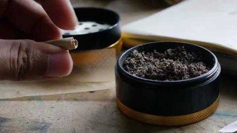 Preparing Handmade Weed Joint with Dried Herb. Stock Footage 319756333
