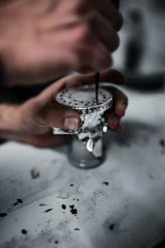 Preparing a head for a hookah Stock Photos