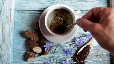 Preparing a healthy coffee substitute infusion made with chicory root Stock Footage 166046058