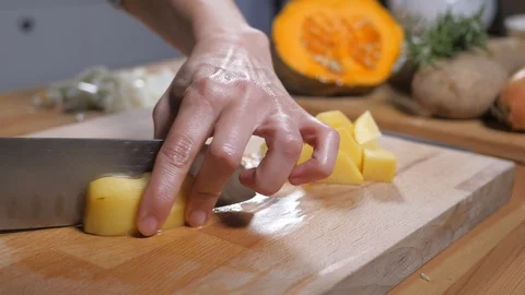 Preparing healthy eating vegetable organic food, dice potatoes Stock Footage 104553019