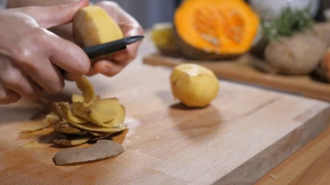 Preparing healthy eating vegetable organic food, peeling potatoes Stock Footage 104554847