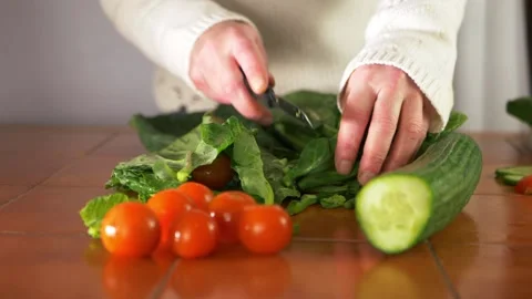 Preparing healthy fresh vegetables in the kitchen Stock Footage 149058753