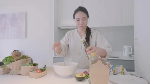 Preparing a Healthy Meal in a Modern Kitchen Stock Footage 313942354
