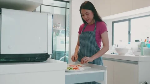 Preparing Healthy Meals in a Modern Kitchen Stock Footage 313832548