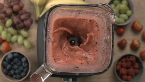 Preparing healthy smoothie made of berries, top view perspective of blender.. Stock Footage 255863557