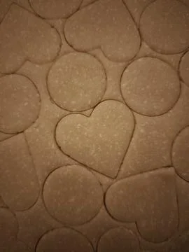Preparing heart and circle shaped cookies from dough for valentine's day Stock Photos