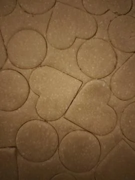 Preparing heart and circle shaped cookies from dough for valentine's day Stock Photos