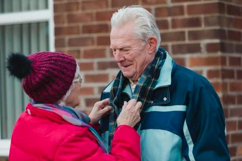 Preparing Her Husband for the Cold Photos