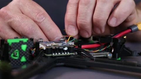 Preparing high-speed racing quadcopter for flight Stock Footage 156068156