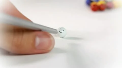 Preparing to hit a smiling face in pool table on white backround Video stock 12341086