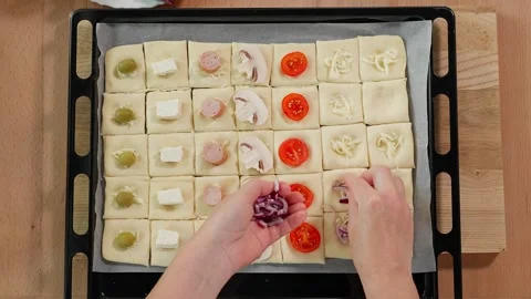Preparing a holiday snack puff pastry squares Stock Footage 255408508