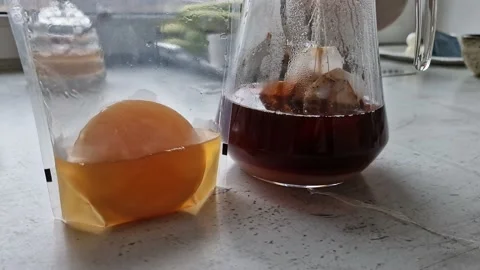 Preparing a home made kombucha from the black tea Stock Footage 234059480
