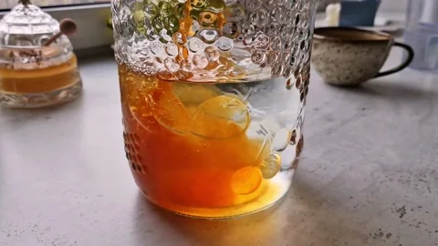 Preparing a home made kombucha from the black tea Stock Footage 234061524