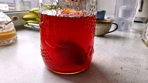 Preparing a home made kombucha from the black tea Stock Footage 234061638