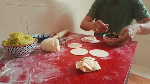 Preparing Homemade Dumplings:  Step-by-Step Culinary Process in a Modern Kitchen Stock Footage 335382132