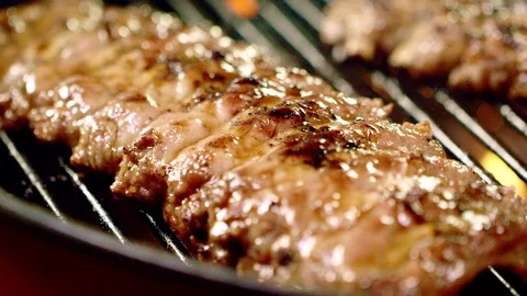 Preparing homestyle Delicious Baby Back Ribs On Charcoal Barbecue Grill Stock Footage 126755053