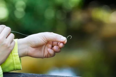 Preparing hook for fishing Stock Photos