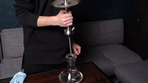 Preparing hookah. Step by step. Hookah man assembles hookah piece by piece Stock Footage 153217118