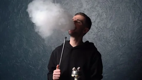 Preparing hookah. Step by step. Hookah man lights hookah and blows smoke. 库存影片 153217398