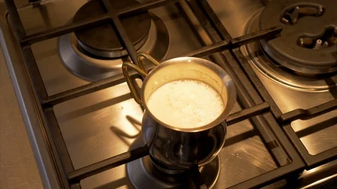 Preparing hot milk for breakfast Stock Footage 85512688