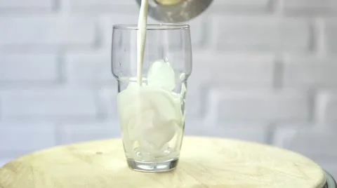 Preparing ice latte with milk and coffee slow motion Stock Footage 67902826