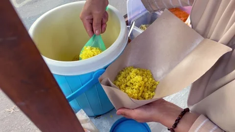 Preparing indonesian yellow rice wrap. Stock Footage 321131940
