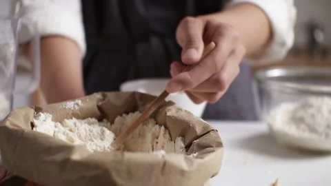 Preparing ingredients for dough. Weighing flour on mechanical scales. White Stock Footage 201754497
