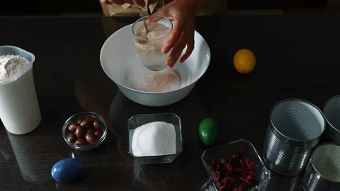 Preparing ingredients for Easter recipe with decorative egg and kitchen utensil Stock Footage 297663183