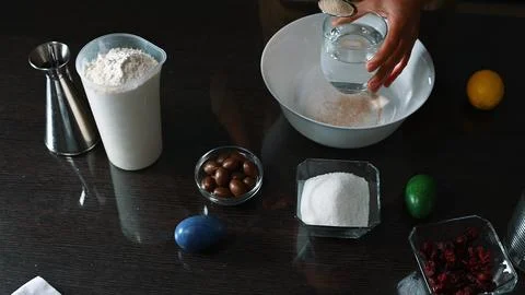 Preparing ingredients for Easter recipe with decorative egg and kitchen utensil Stock Photos