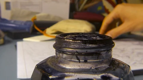 Preparing the ink and the pen to draw Stock Footage 103278580