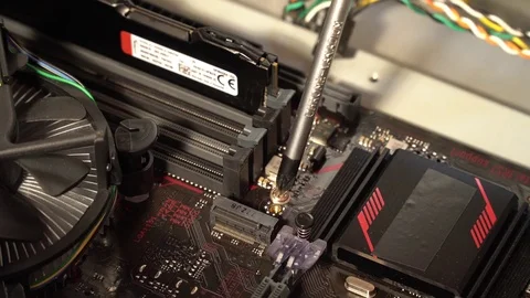 Preparing to install the central processor in the motherboard slot. Stock Footage 83168303
