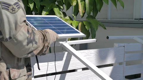 Preparing to install solar cell panel on the stand Stock Footage 287326287