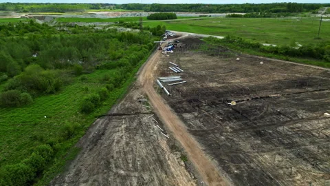Preparing to install a solar panel farm in the countryside - drone parallax Stock-Footage 291119768