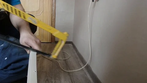 Preparing to install a stretch ceiling Stock Footage 88485283