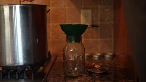 Preparing a jar for canning, two camera view, USA, October, 2025 Stock Footage 318255342