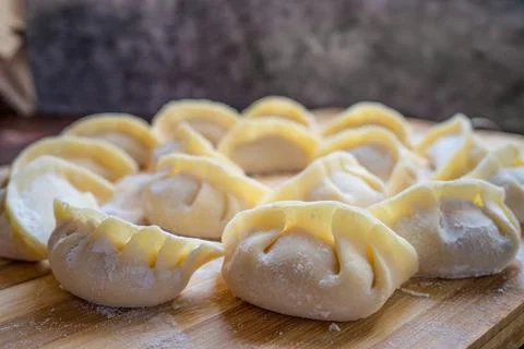Preparing Jiaozi In Kitchen Stock Photos