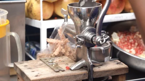 Preparing juice with juice machine Stock Footage 60223785