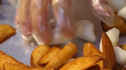 Preparing Korean Fried Chicken with Rice Cakes and Crispy Potato Wedges Video stock 343027066